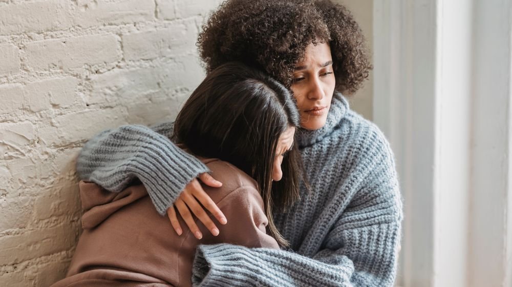 A supportive friend comforting a loved one experiencing depression