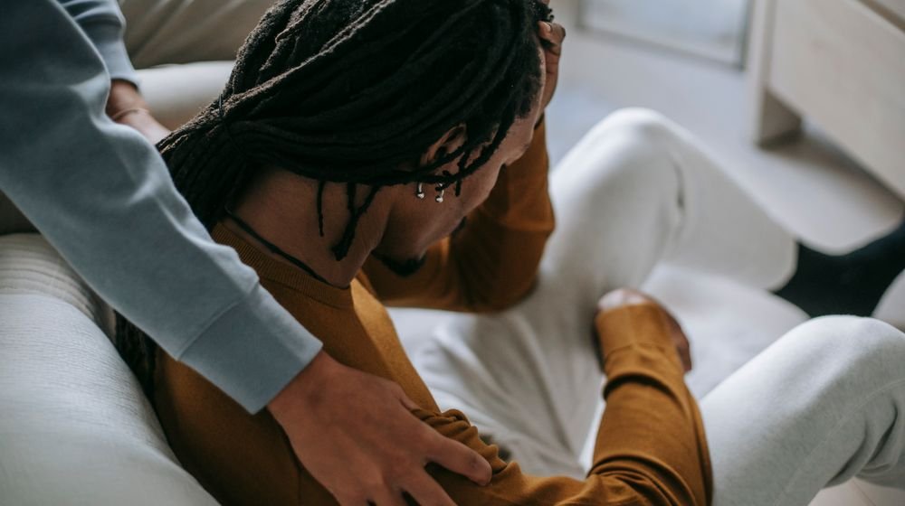 Person reflecting quietly, recognising the signs you need therapy and support