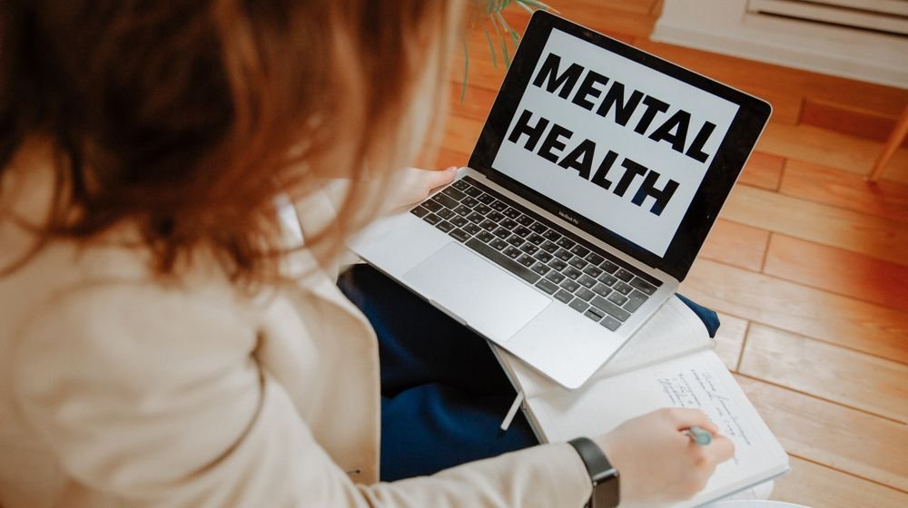 Family members offering emotional support to a loved one with mental illness